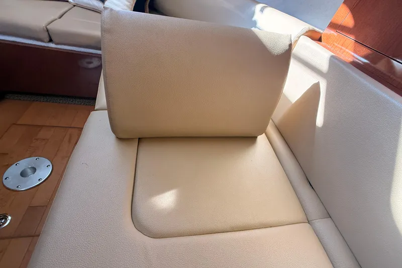 Slide: The Image of Beige leather seating on 2012 Sea Ray 310 Sundancer boat interior. - 78