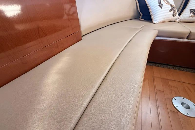 Slide: The Image of Luxurious interior seating of 2012 Sea Ray 310 Sundancer with elegant wood finish. - 79