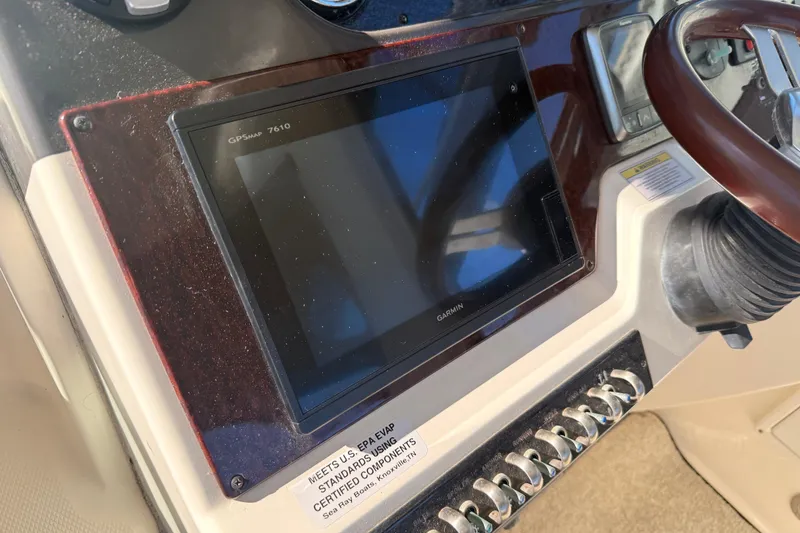 Slide: The Image of Control panel of 2012 Sea Ray 310 Sundancer with Garmin GPSmap 7610 display. - 83