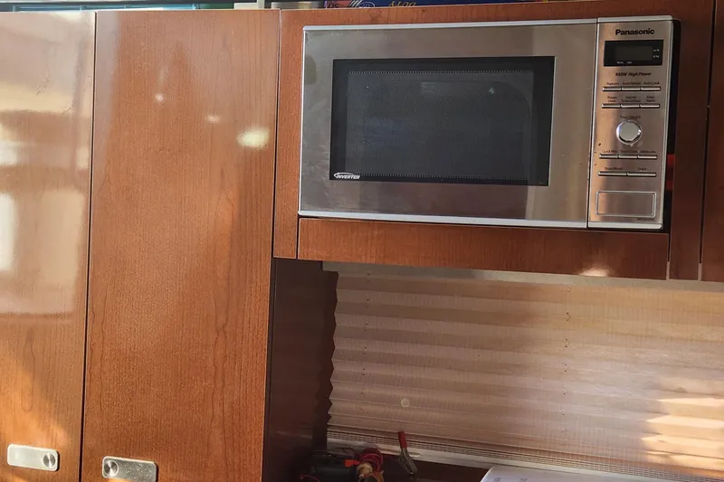 Slide: The Image of Close-up of 2012 Sea Ray 310 Sundancer boat engine component near water. - 9