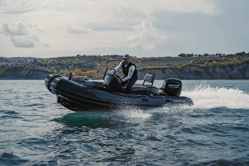 Slide: The Image of 2026 Highfield Patrol 460 boat on the water. - 1