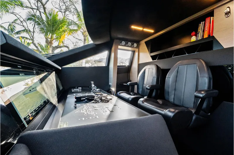 Slide: The Image of Luxurious 2019 Ferretti Yachts 780 cockpit with modern controls and leather seating. - 33