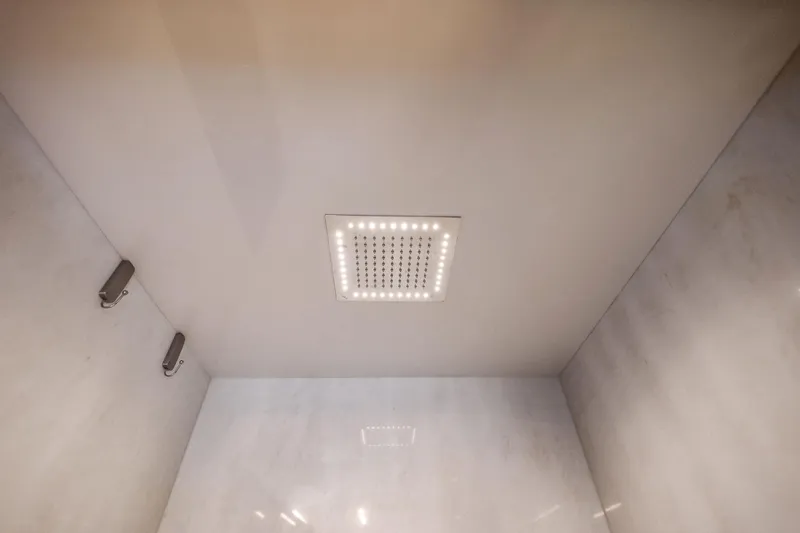 Slide: The Image of Ceiling showerhead with LED lights in 2019 Ferretti Yachts 780 bathroom. - 40