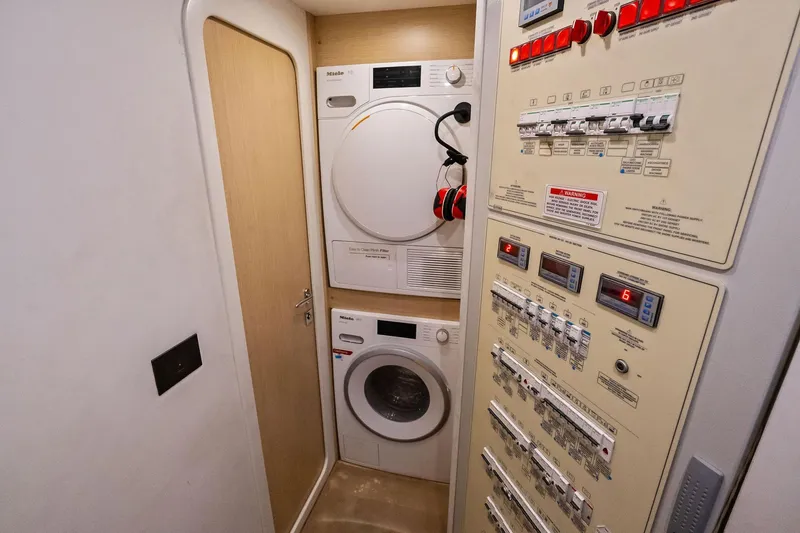 Slide: The Image of Laundry and control panel area on a 2019 Ferretti Yachts 780. - 61