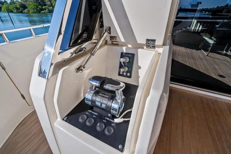 Slide: The Image of Control panel on 2019 Ferretti Yachts 780, featuring engine controls and sleek design. - 11