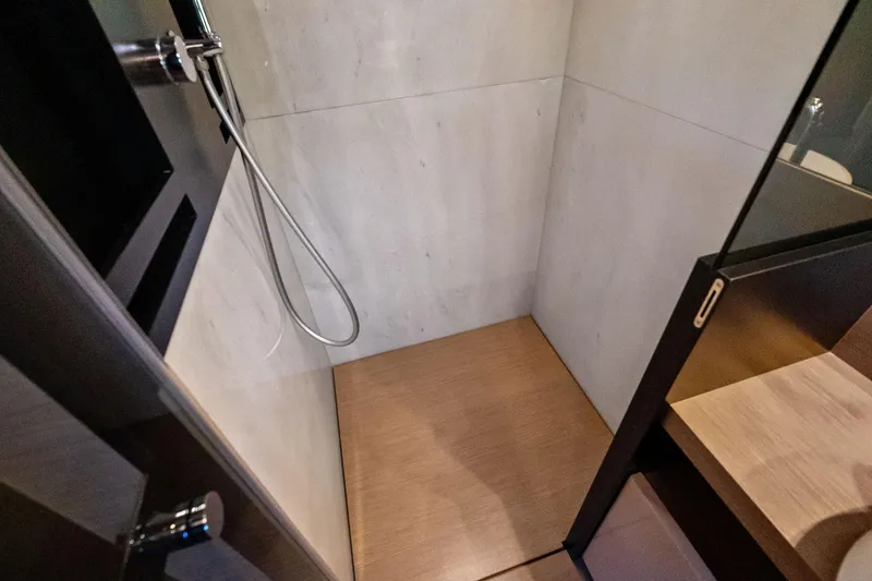 Slide: The Image of Shower area in 2019 Ferretti Yachts 780, featuring modern design and wooden flooring. - 42