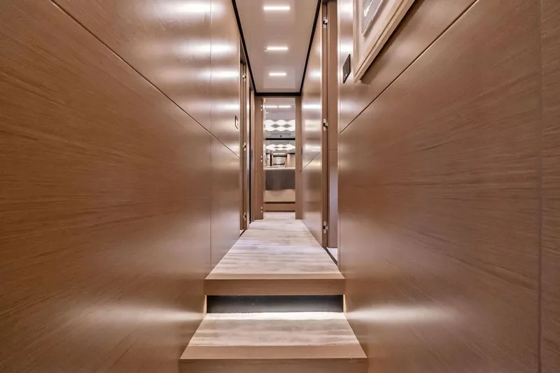 Slide: The Image of Luxurious interior hallway of 2019 Ferretti Yachts 780 with modern wood paneling. - 44