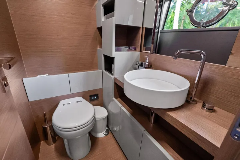 Slide: The Image of Luxurious bathroom in 2019 Ferretti Yachts 780, featuring modern fixtures and elegant wood finishes. - 48