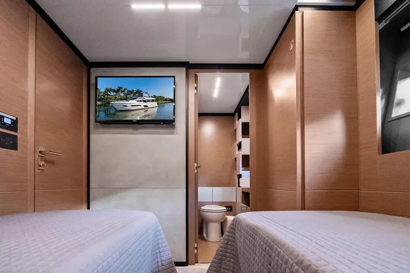 Slide: The Image of Luxurious 2019 Ferretti Yachts 780 cabin interior with twin beds and modern amenities. - 50