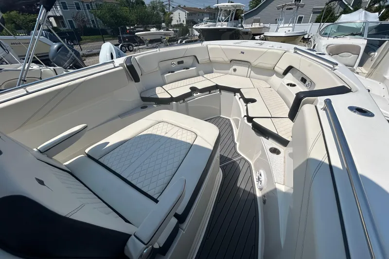 Slide: The Image of 2024 Stingray 273 CC boat interior with spacious seating and modern design. - 5
