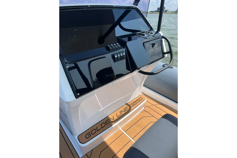 Slide: The Image of 2025 Grand Inflatables G850 boat dashboard with sleek design and modern controls. - 11