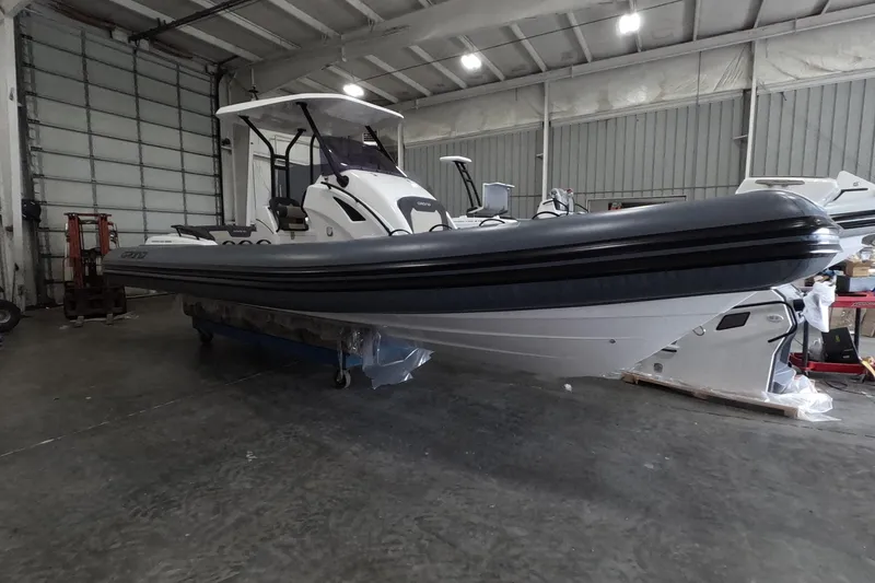 Slide: The Image of 2025 Grand Inflatables G850 boat in a warehouse setting. - 3