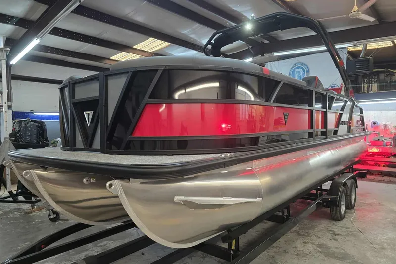 The Image of 2026 Trifecta SS 25RF pontoon boat in a showroom, showcasing sleek design and modern features. - 1