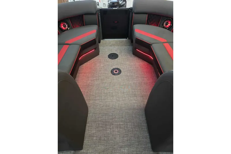 Slide: The Image of Interior of 2026 Trifecta SS 25RF boat with red-accented seating and ambient lighting. - 16
