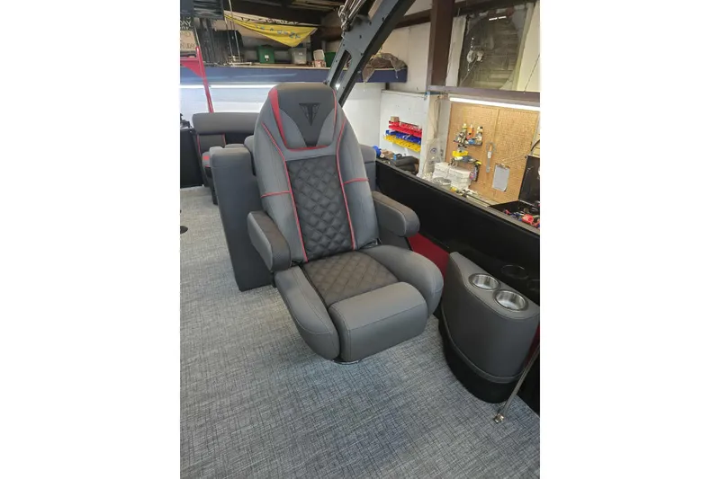 Slide: The Image of Luxurious seating in 2026 Trifecta SS 25RF boat, featuring gray upholstery and red accents. - 22