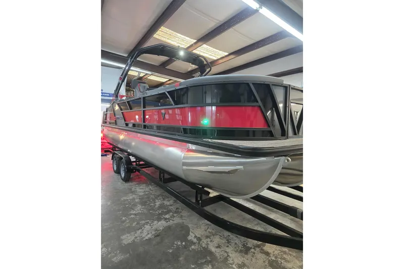 Slide: The Image of 2026 Trifecta SS 25RF pontoon boat in showroom, featuring sleek design and modern features. - 8