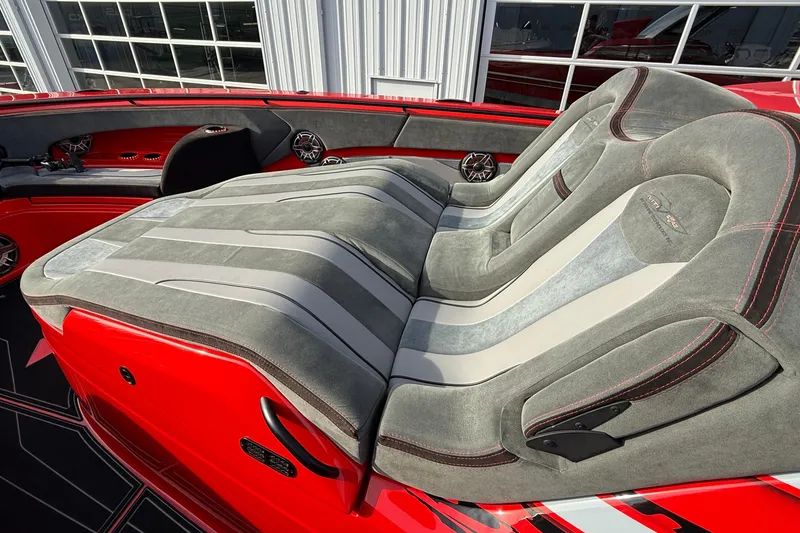 Slide: The Image of Luxurious seating on 2020 MTI 42V boat with red and gray upholstery. - 11