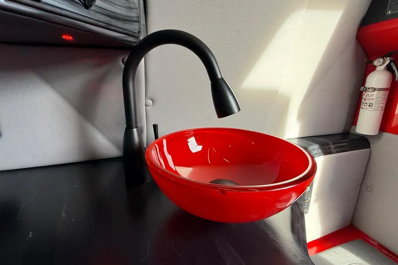 Slide: The Image of Red bowl sink with black faucet in MTI 42V, 2020 model interior. - 15