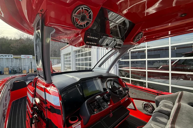 Slide: The Image of Red 2020 MTI 42V boat interior with advanced dashboard and sleek design. - 19