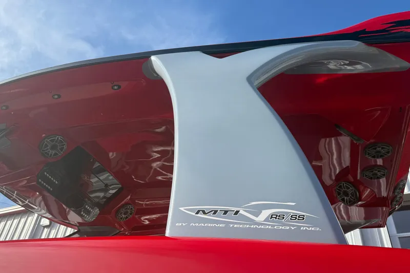 Slide: The Image of Red and gray MTI 42V boat underside, showcasing speakers and sleek design, 2020 model. - 25