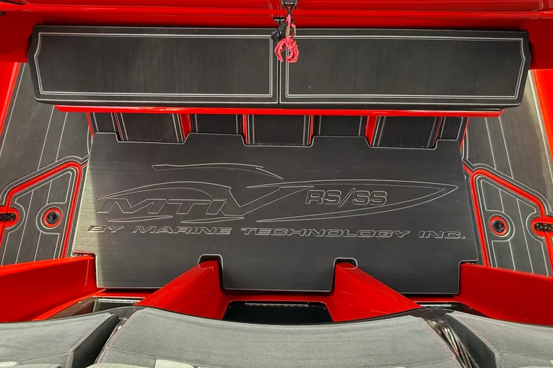 Slide: The Image of MTI 42V 2020 boat interior with Marine Technology Inc. branding, featuring red and black design. - 28