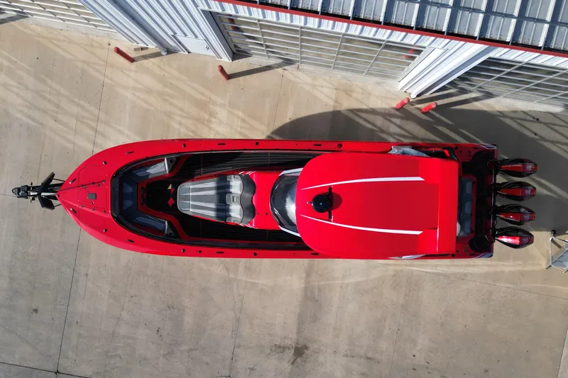 Slide: The Image of Overhead view of a red 2020 MTI 42V boat with four engines docked. - 3