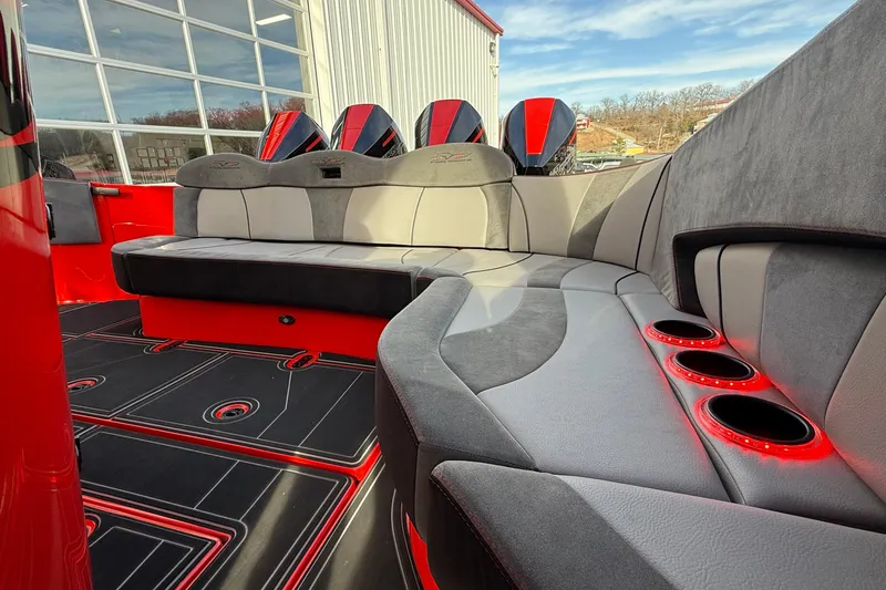 Slide: The Image of Luxurious interior of 2020 MTI 42V boat with red and gray seating and cup holders. - 30