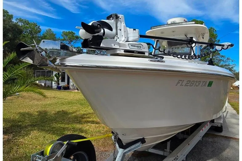 Slide: The Image of 2014 Everglades 295 Pilot boat on trailer, featuring Minn Kota trolling motor. - 11