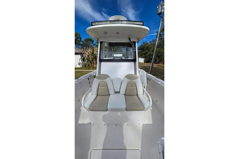 Slide: The Image of 2014 Everglades 295 Pilot boat interior with seating, showcasing sleek design and comfort. - 23