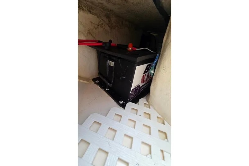 Slide: The Image of Battery compartment of a 2014 Everglades 295 Pilot boat with visible wiring. - 24