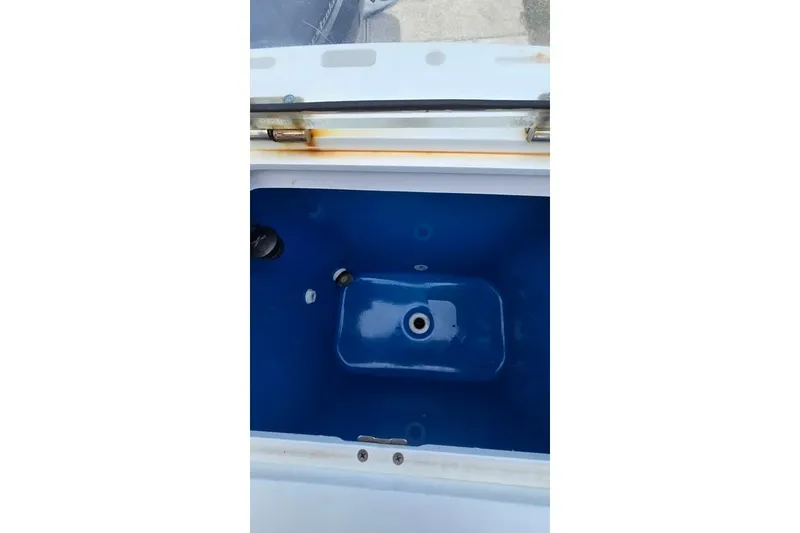 Slide: The Image of 2014 Everglades 295 Pilot boat livewell interior, blue and white design. - 33
