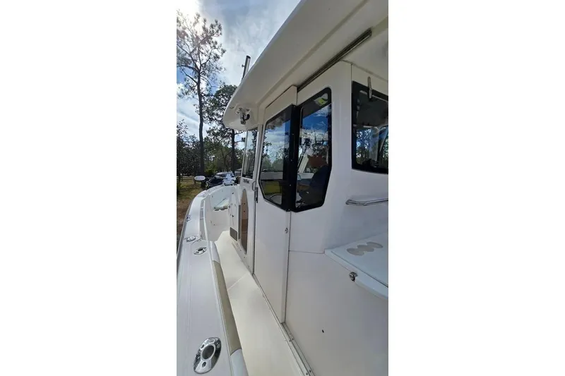 Slide: The Image of 2014 Everglades 295 Pilot boat, side view with cabin and deck details. - 36