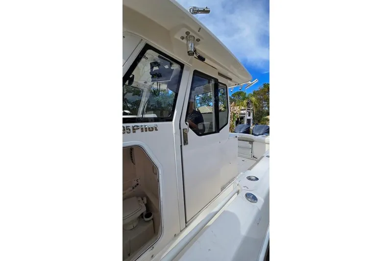 Slide: The Image of 2014 Everglades 295 Pilot boat exterior with cabin and deck view. - 38