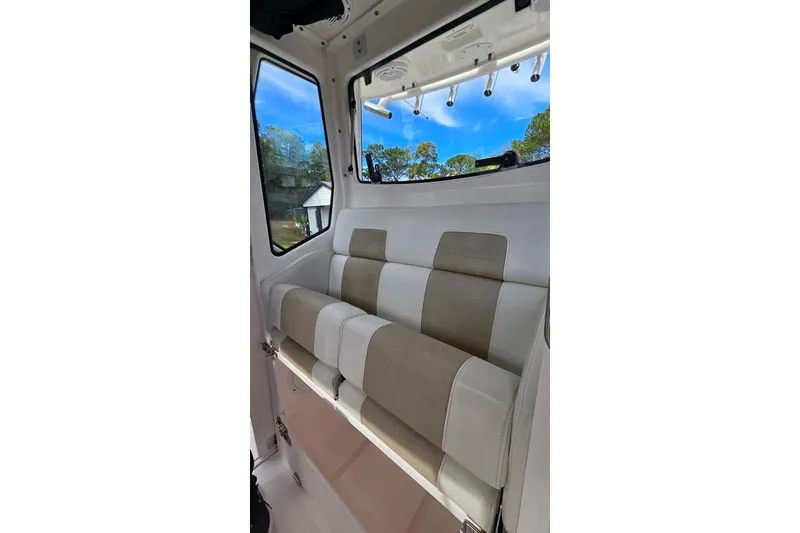 Slide: The Image of Interior seating of 2014 Everglades 295 Pilot boat, featuring beige and white upholstery. - 42