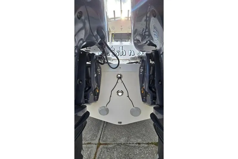 Slide: The Image of Rear view of a 2014 Everglades 295 Pilot boat's dual outboard motors. - 5