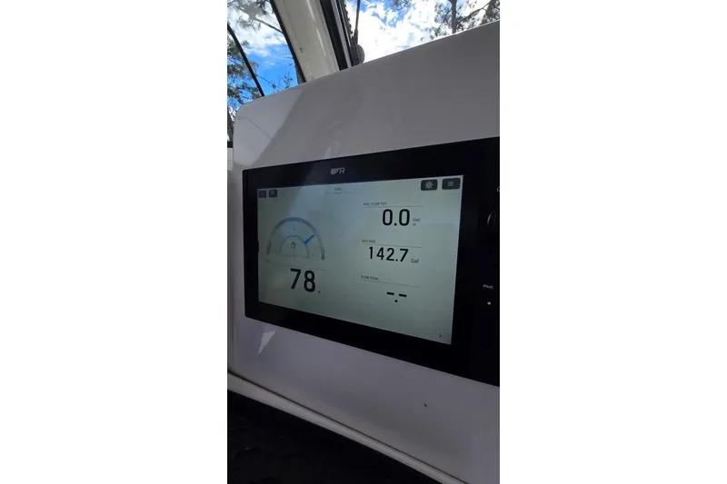 Slide: The Image of Display screen on 2014 Everglades 295 Pilot boat showing speed and fuel data. - 57