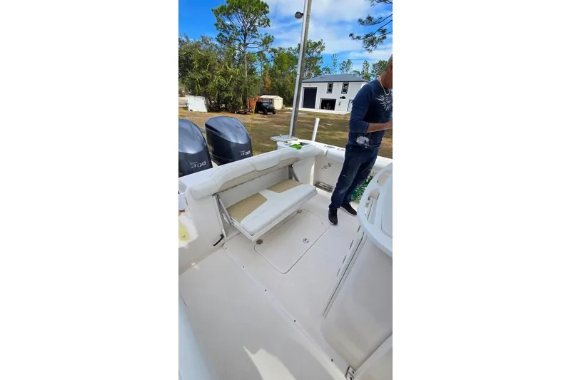 Slide: The Image of 2014 Everglades 295 Pilot boat interior with seating and dual engines. - 64