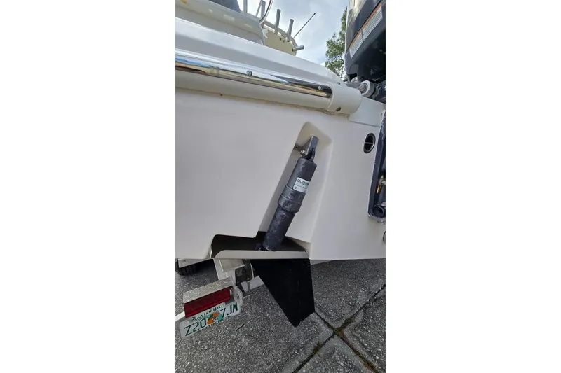 Slide: The Image of 2014 Everglades 295 Pilot boat stern with hydraulic component and Florida license plate. - 69