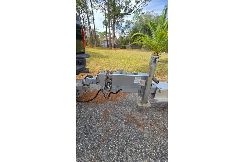 Slide: The Image of Trailer hitch of a 2014 Everglades 295 Pilot boat on a driveway. - 72