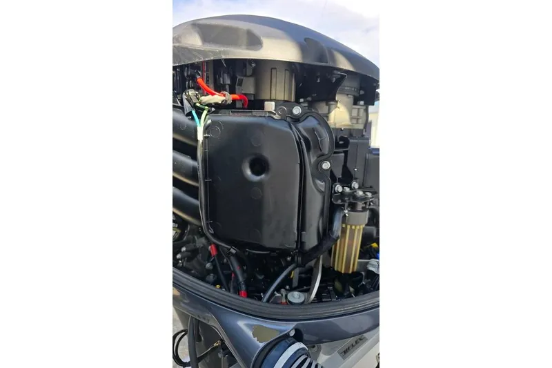 Slide: The Image of Close-up of a 2014 Everglades 295 Pilot boat engine, showcasing intricate components. - 82
