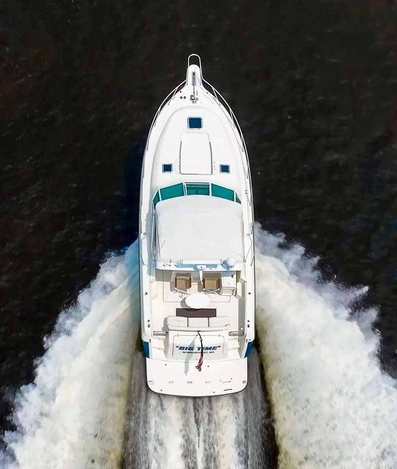 Slide: The Image of Aerial view of 1996 Tiara Yachts 3500 Express cruising on water. - 13