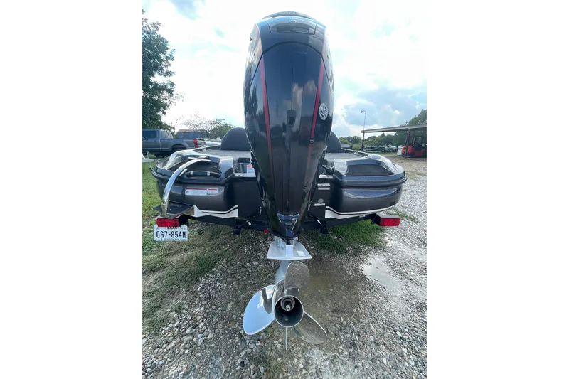 Slide: The Image of Rear view of a 2021 Nitro Z17 boat with outboard motor and Texas license plate. - 10