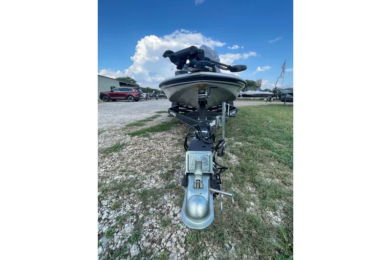 Slide: The Image of 2021 Nitro Z17 boat on trailer, parked outdoors under blue sky. - 4