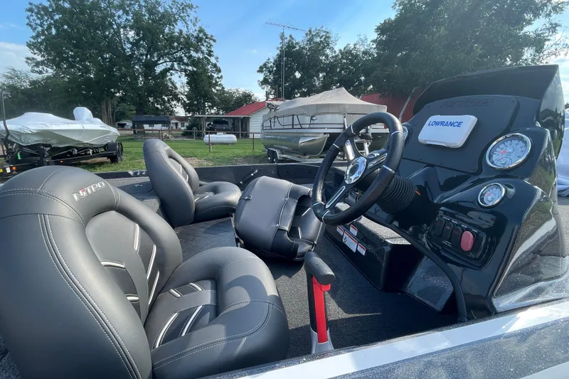 Slide: The Image of Interior of a 2021 Nitro Z17 boat with steering wheel and seats. - 8