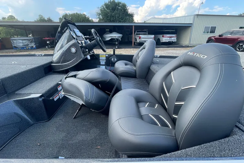 Slide: The Image of 2021 Nitro Z17 boat interior with sleek gray seating and modern dashboard. - 9