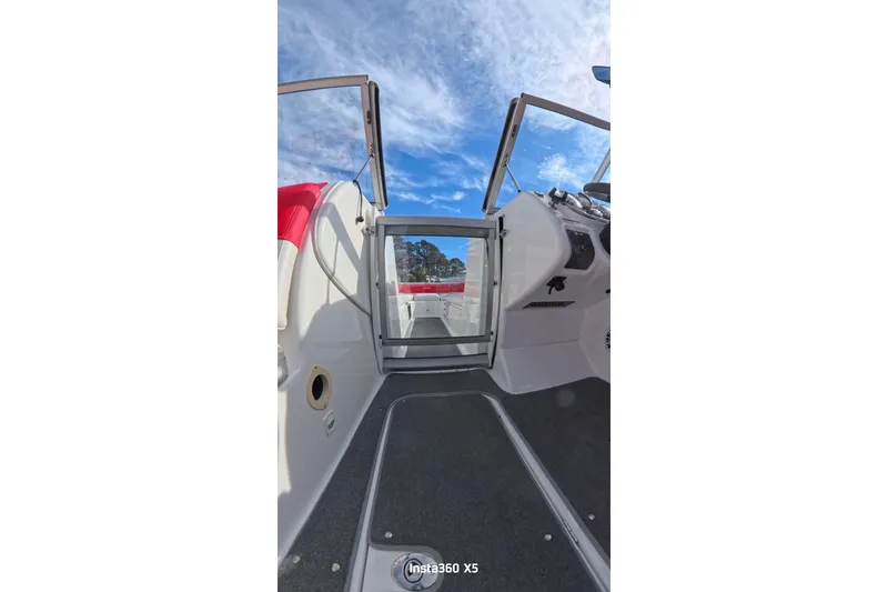 Slide: The Image of Interior view of 2009 Sea-Doo 230 Wake boat with red seating. - 14