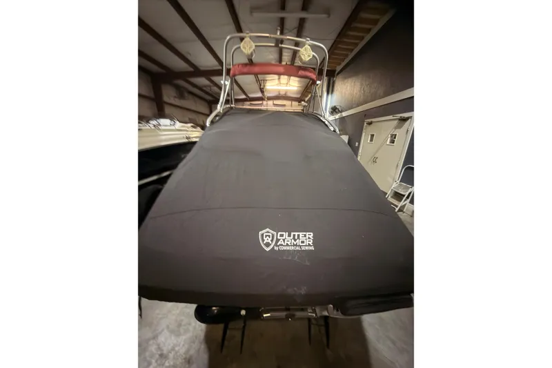 Slide: The Image of 2009 Sea-Doo 230 Wake boat with Outer Armor cover in storage. - 20