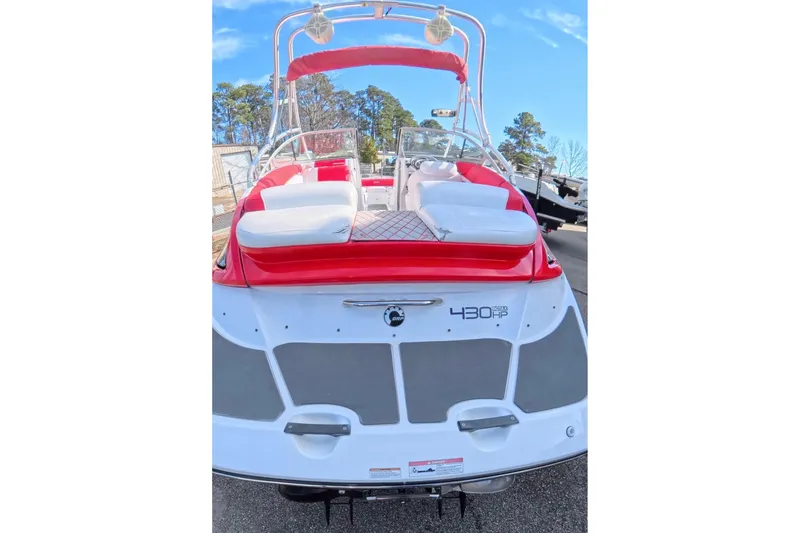 Slide: The Image of 2009 Sea-Doo Sport Boats 230 Wake on trailer, parked outdoors, side view. - 5