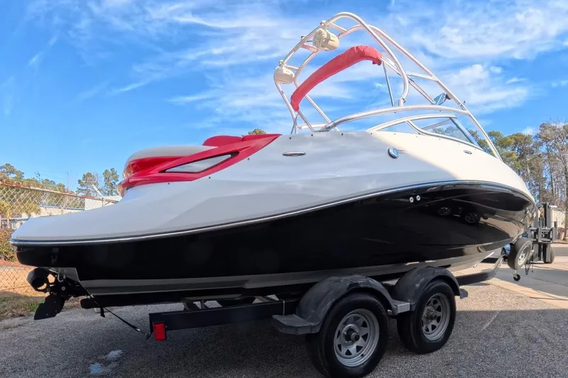 Slide: The Image of 2009 Sea-Doo Sport Boats 230 Wake covered in storage, on trailer. - 7
