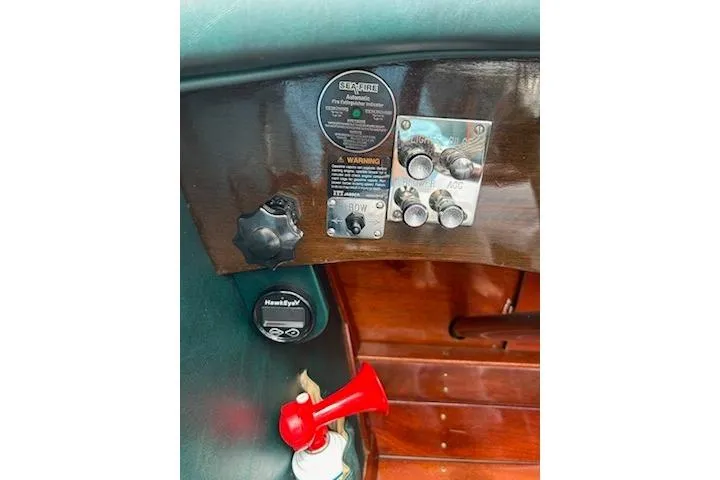 Slide: The Image of Control panel of a 1997 Hacker-Craft 26' Runabout with gauges and switches. - 17